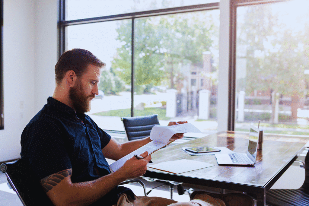Professional reviewing legal documents in a bright office during the Notarization process to ensure authenticity and compliance in the UAE.