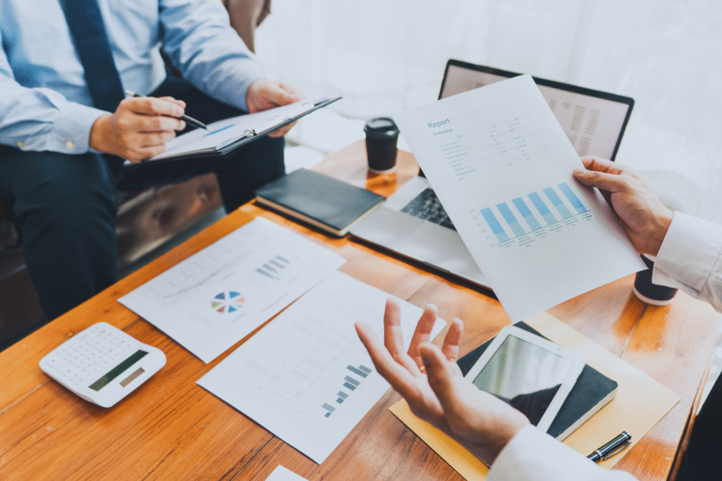 Business team reviewing reports and documents for RTA Approval process