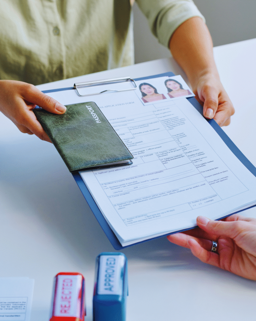 Close-up of a person submitting passport and documents for UAE Visa Application and Renewal, ensuring smooth processing and official approval.